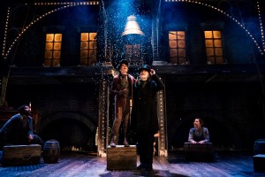 The Christmas Carol cast at the Leeds Playhouse productions: Lladel Bryant (future), Seb Smallwood (Tiny Tim), Robert Pickavance (Scrooge), Tessa Parr (future) in A Christmas Carol. Photo by Andrew Billington